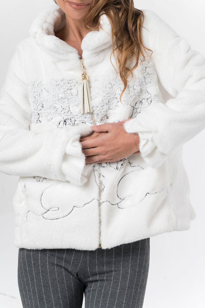 White fur coat with floral embroidery on a white background