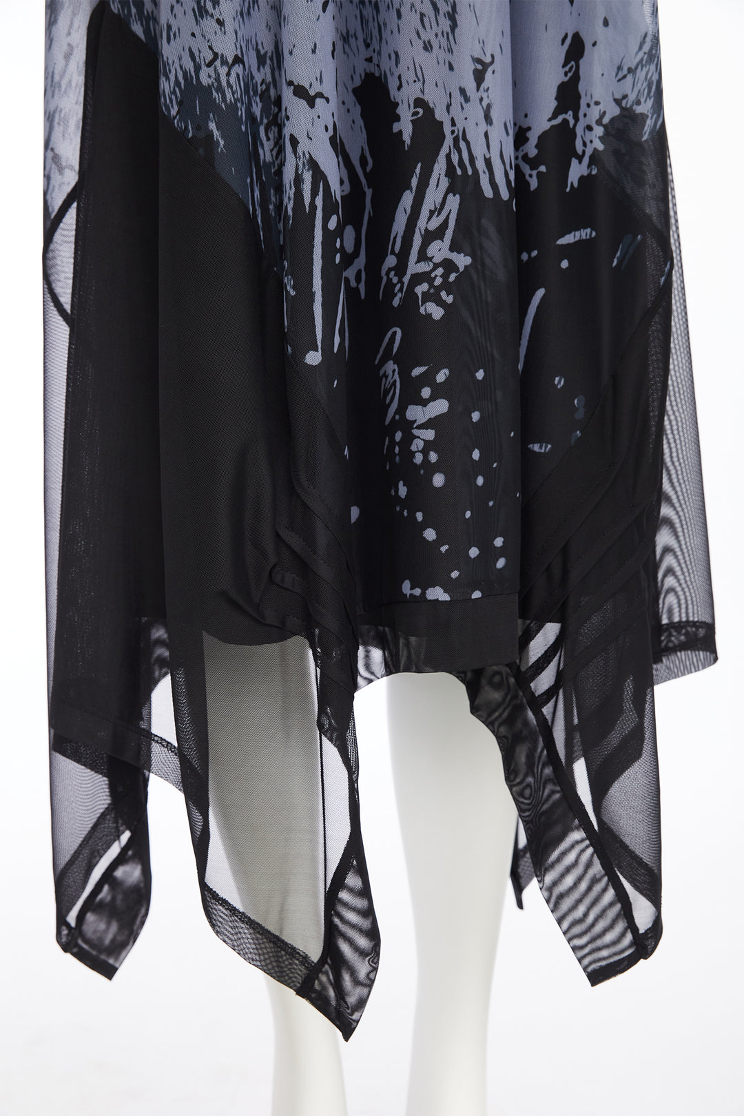 Black and white patterned shirt on a mannequin against a white background