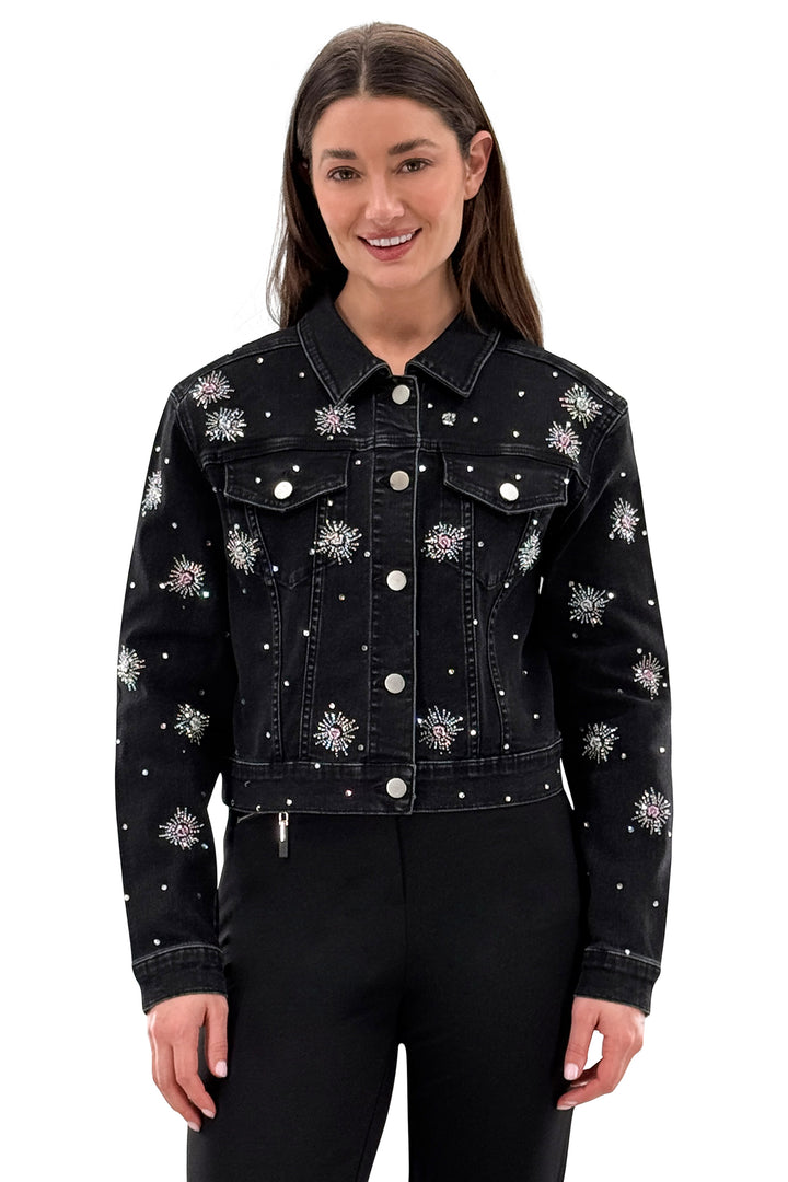 Black denim jacket with floral embellishments worn by a model on a white background