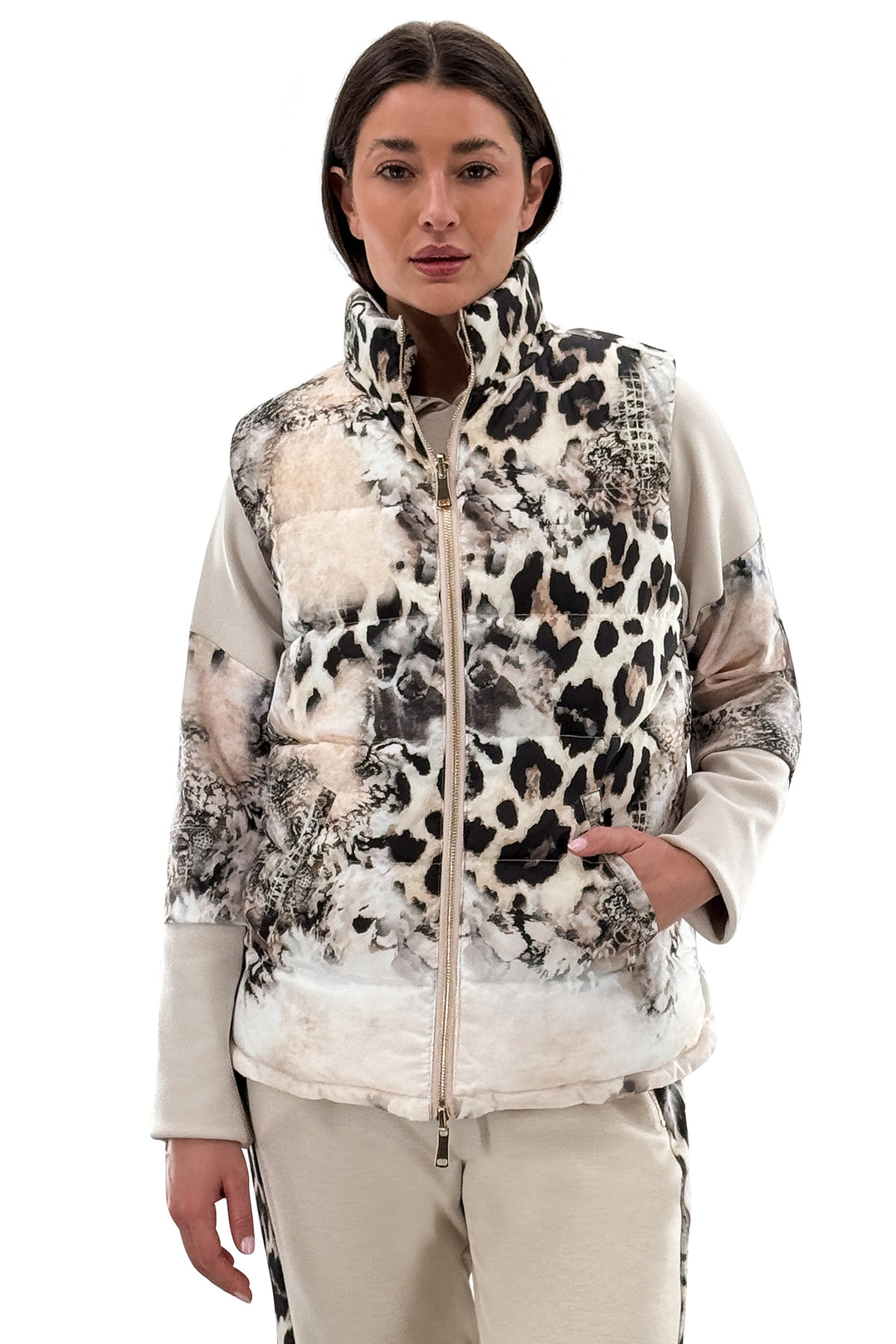 Woman wearing a patterned jacket with a white background