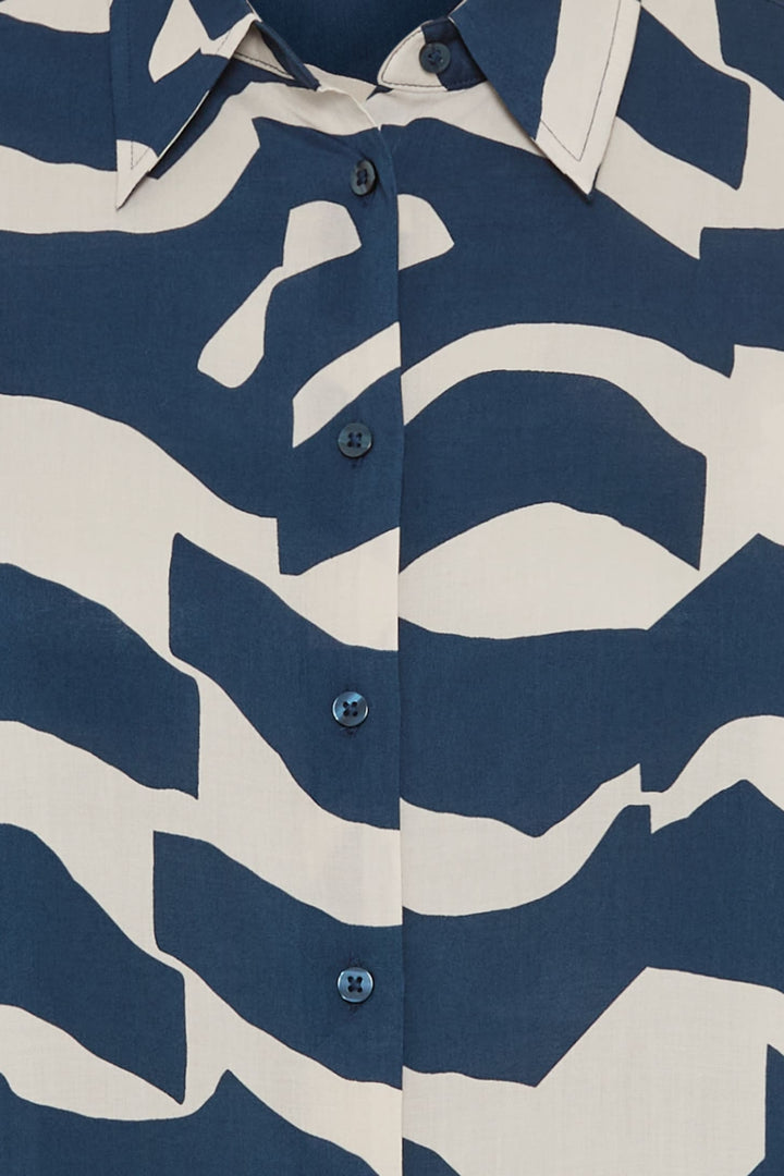 Close-up of a shirt with a blue and white abstract pattern