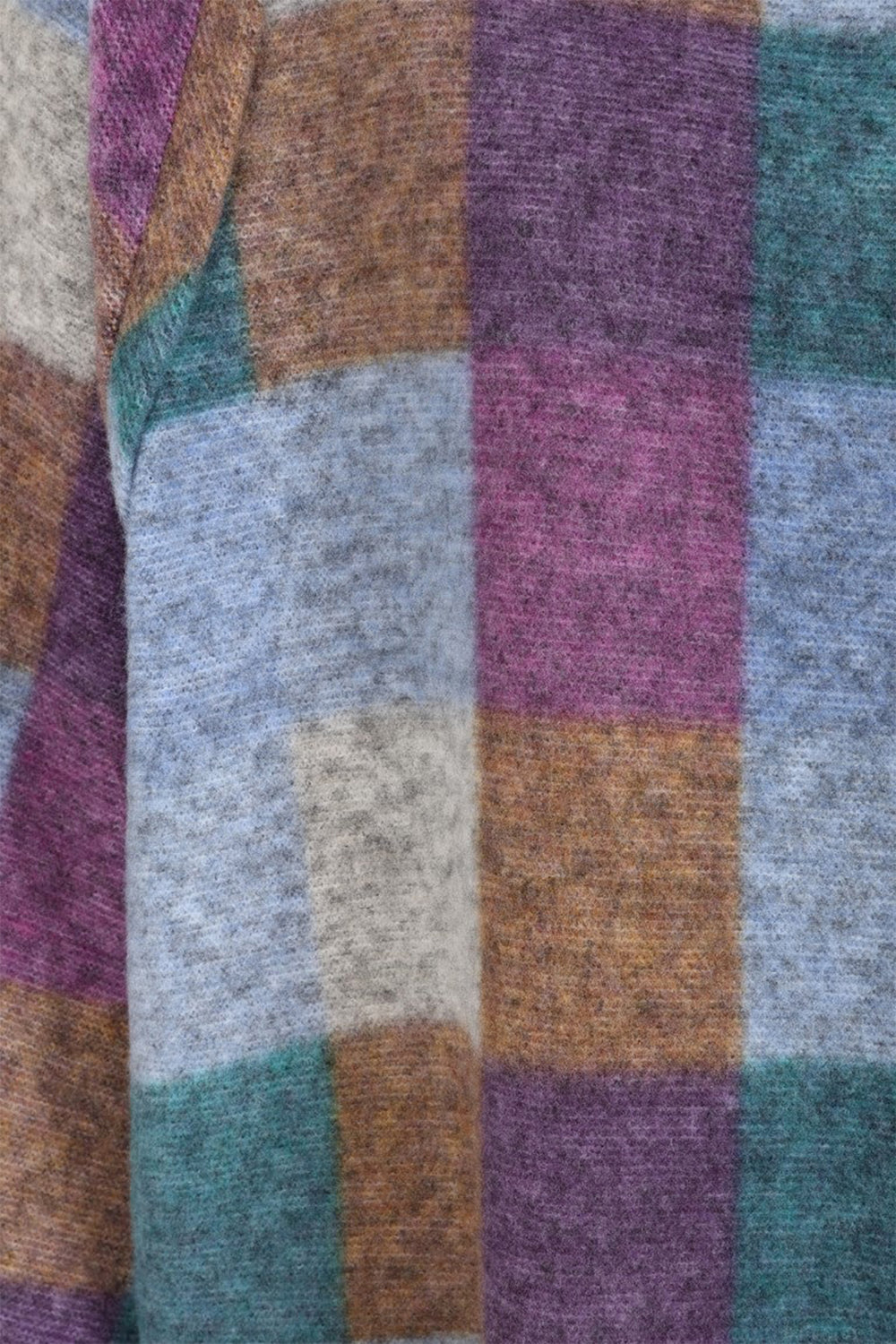 Close-up of a fabric with a checkered pattern in purple, blue, brown, and green.