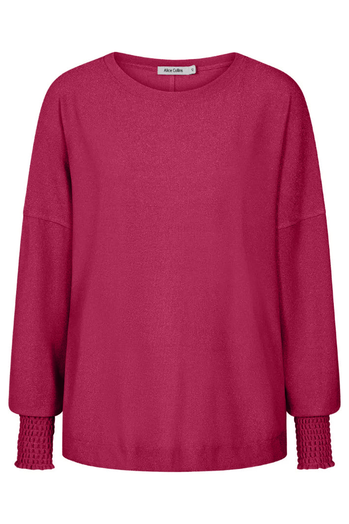 Pink sweatshirt with textured cuffs on a white background