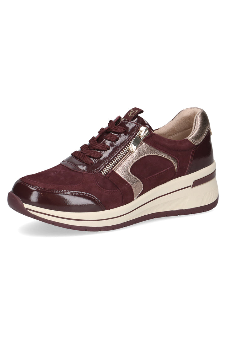 Brown sneaker with a white sole on a white background