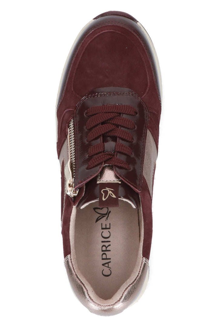 Maroon sneaker with a visible brand logo on a white background