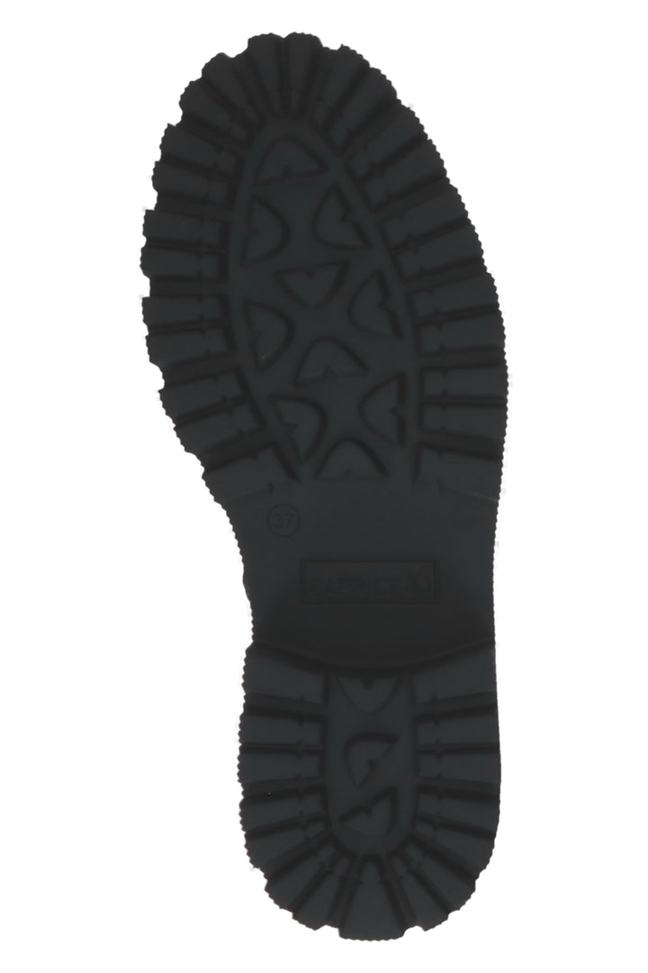 Close-up of a black boot sole on a white background