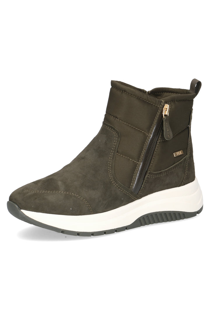 Green ankle boot with white sole on a white background