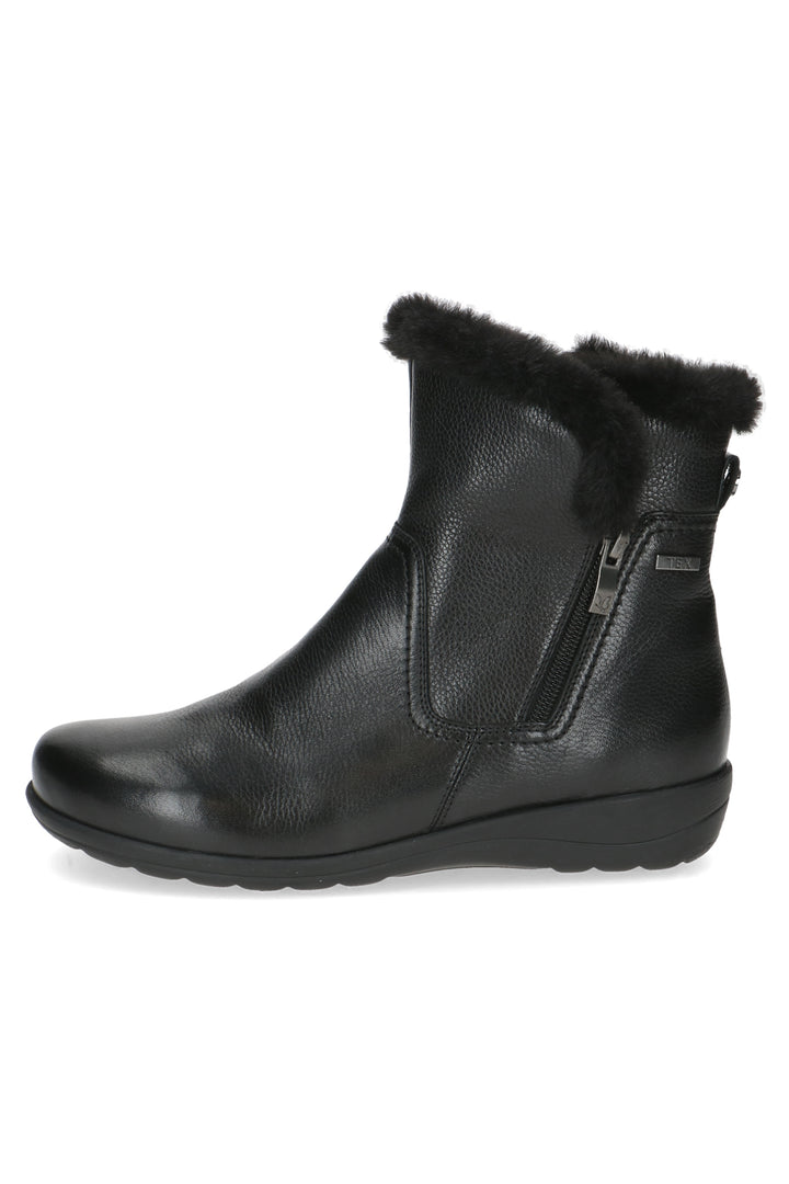 Black leather ankle boot with fur trim on a white background