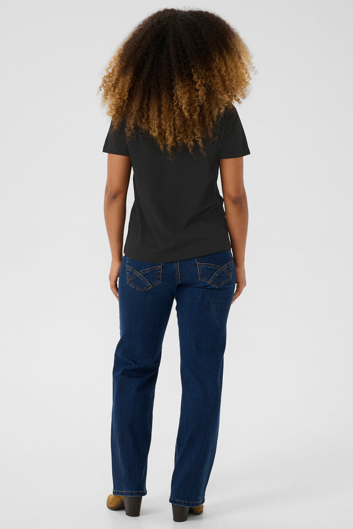 Person wearing a black t-shirt and blue jeans from behind on a white background