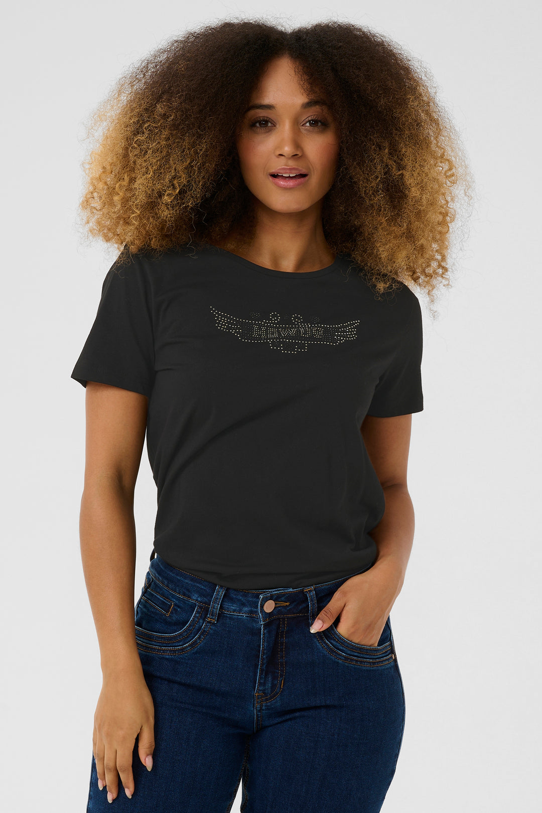 Woman wearing a black t-shirt with a design on a white background