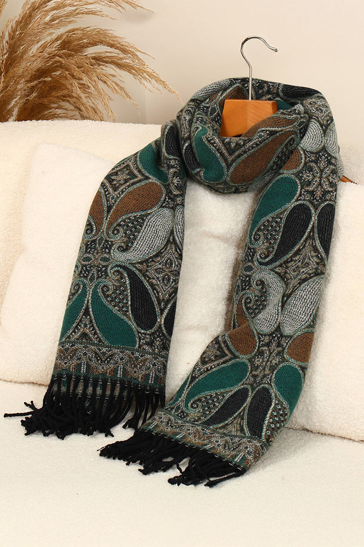 Patterned scarf with black fringes on a white surface