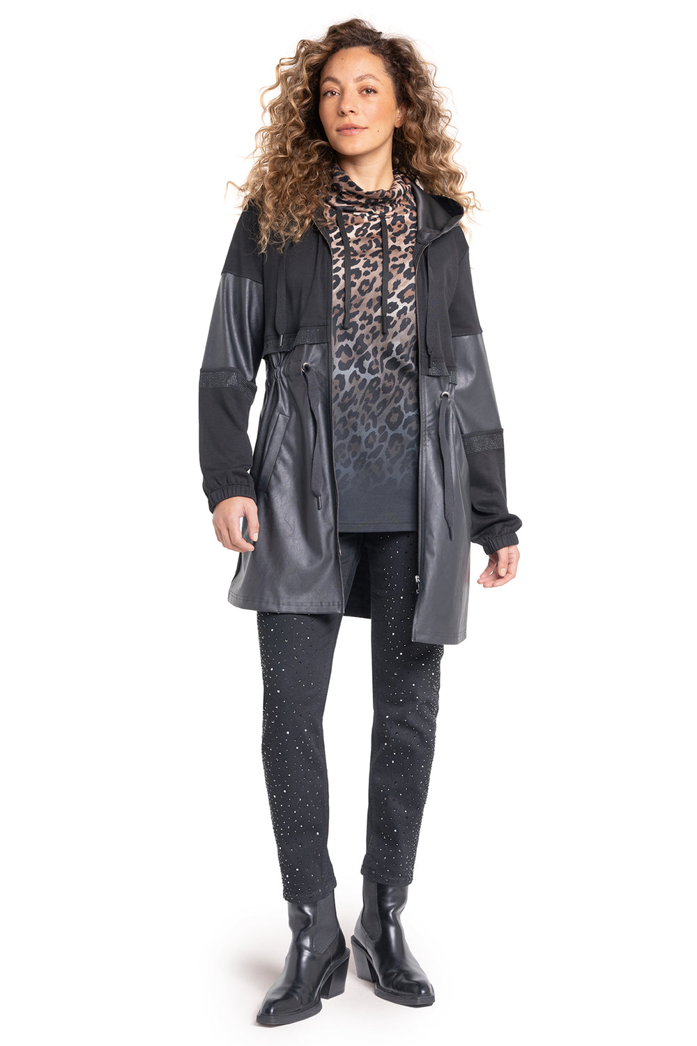 Woman wearing a gray raincoat with a leopard print shirt on a white background