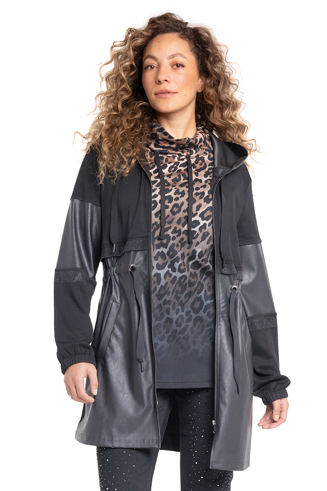 Woman wearing a black and gray coat with a leopard print scarf on a white background