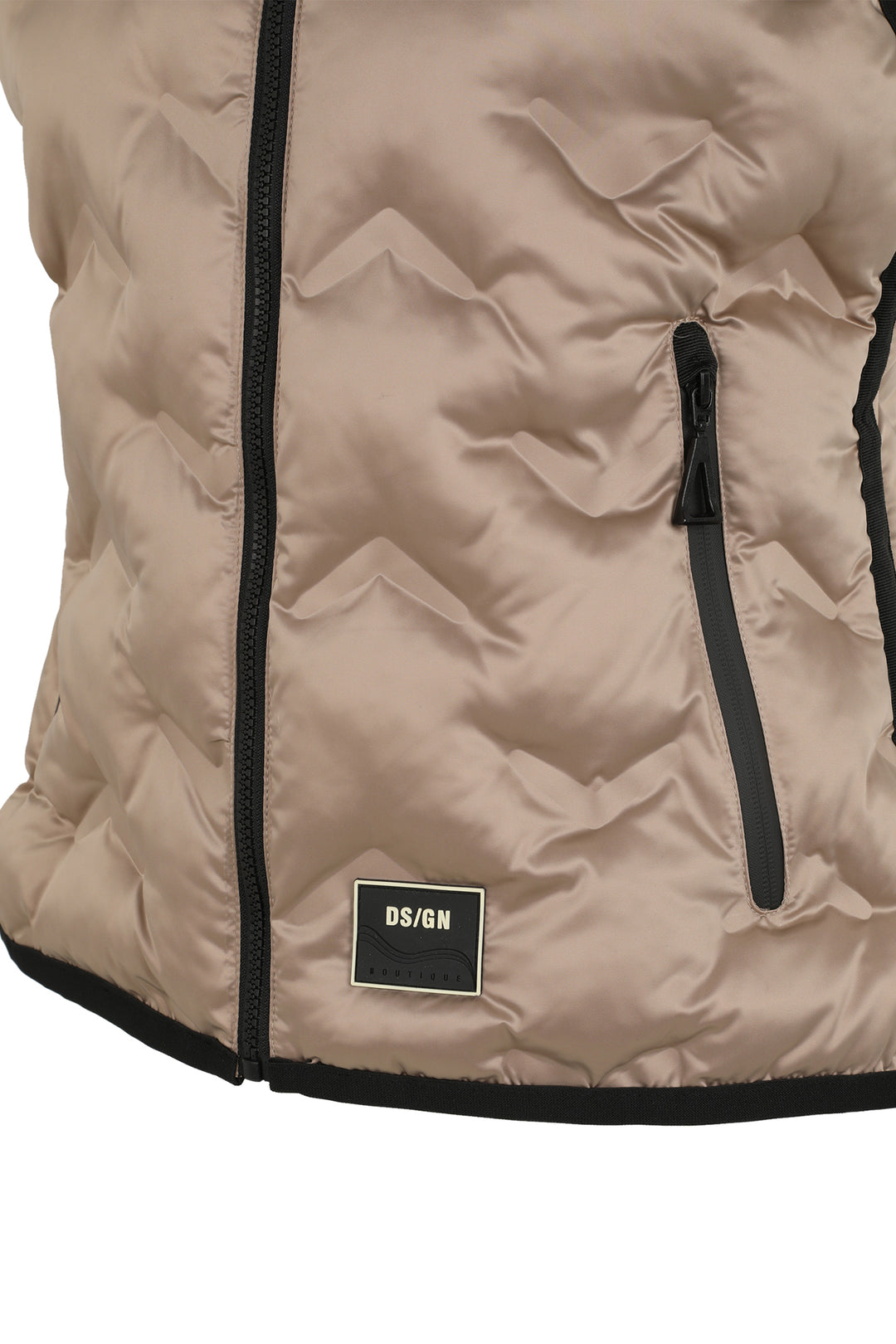Close-up of a beige quilted vest with black zipper and DS/GN label on a white background