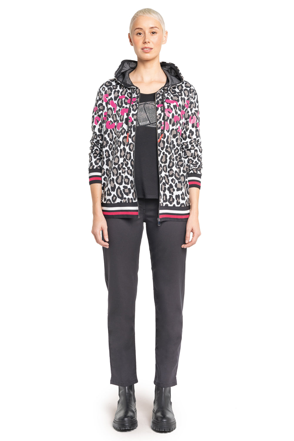 Person wearing a patterned jacket with a white background