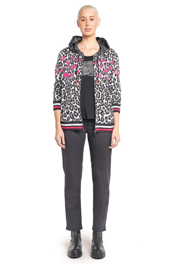 Person wearing a patterned jacket with a white background