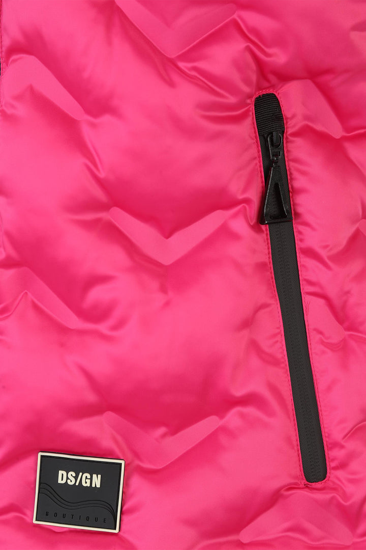 Close-up of a pink puffer jacket with a black zipper and DS/GN label.