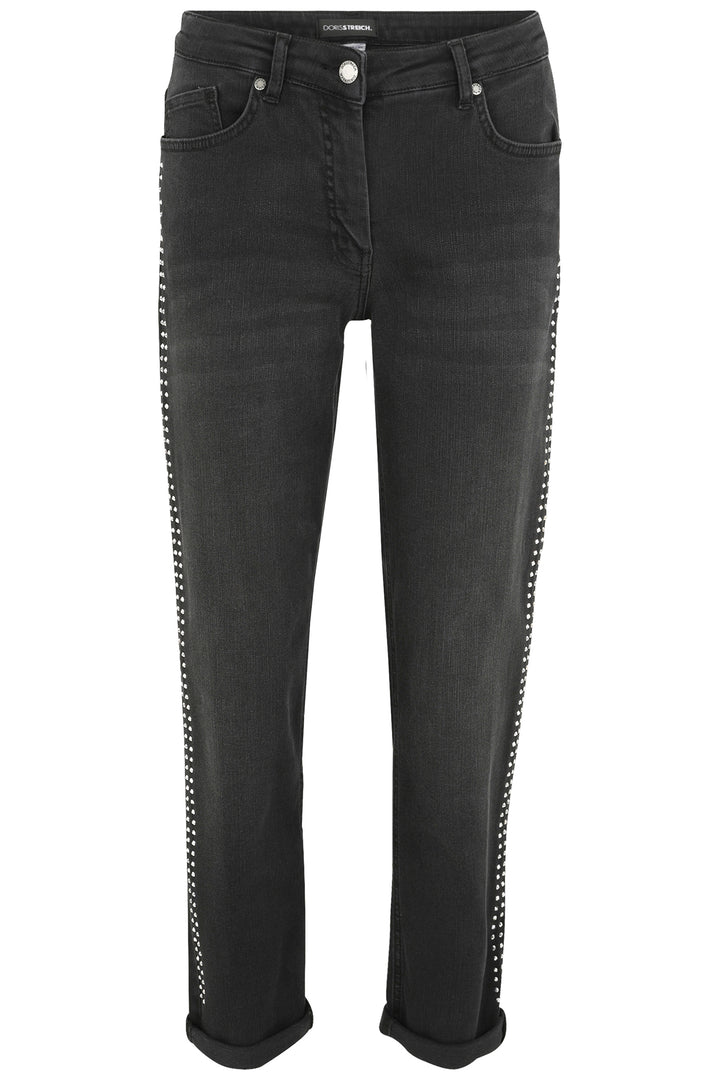 Black jeans with decorative elements on a white background