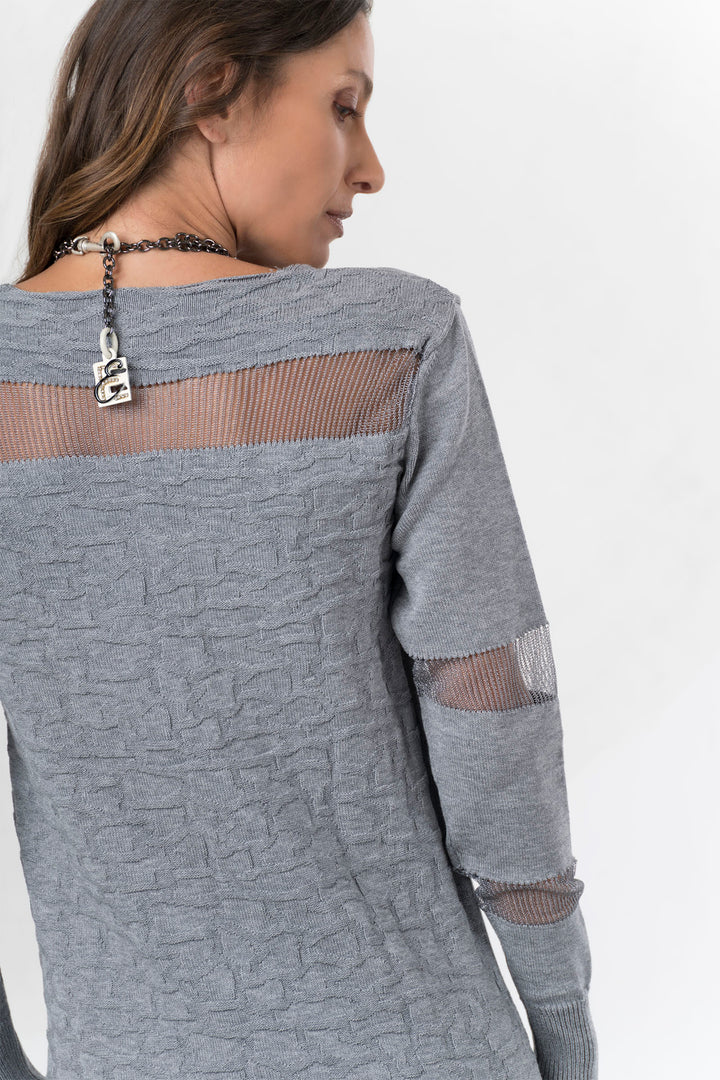 Gray textured sweater with sheer mesh panels on a white background