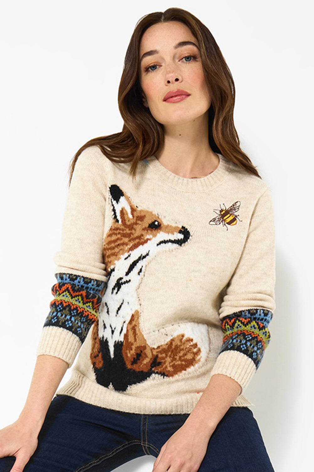 Woman wearing a sweater with a fox design on a white background