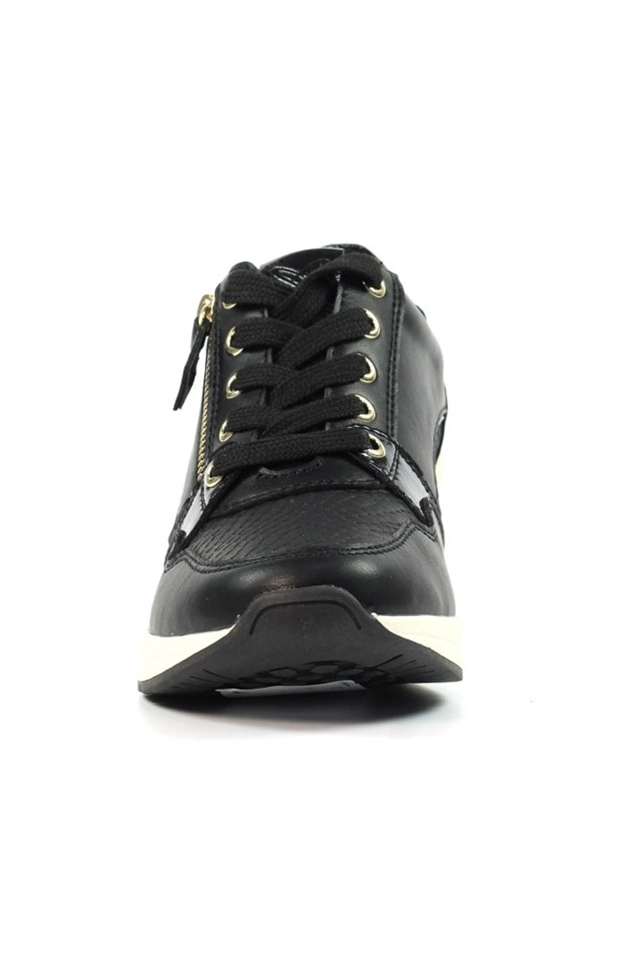 Black sneaker with gold accents on a white background