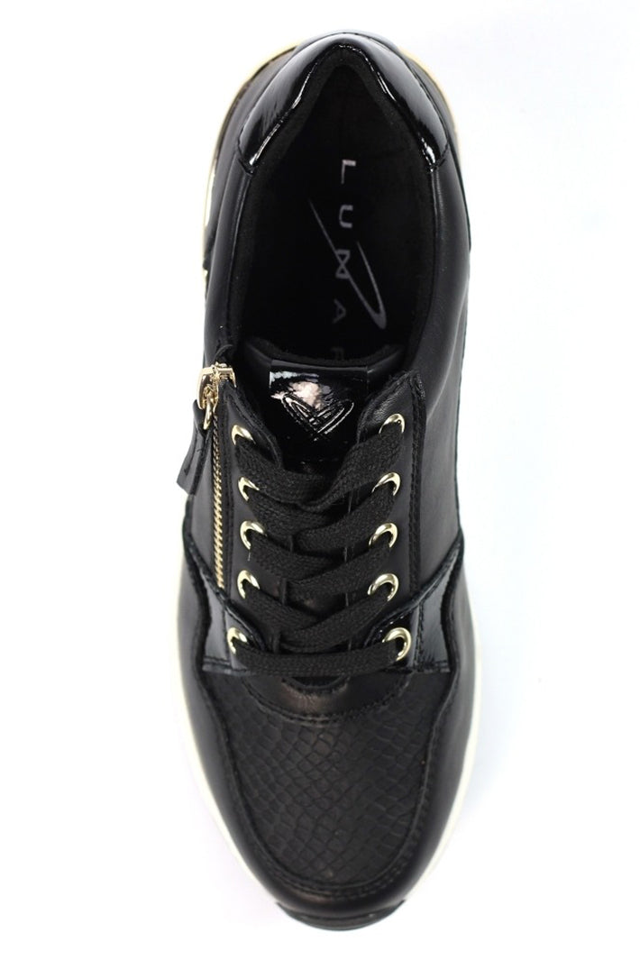 Black sneaker with gold zipper on a white background