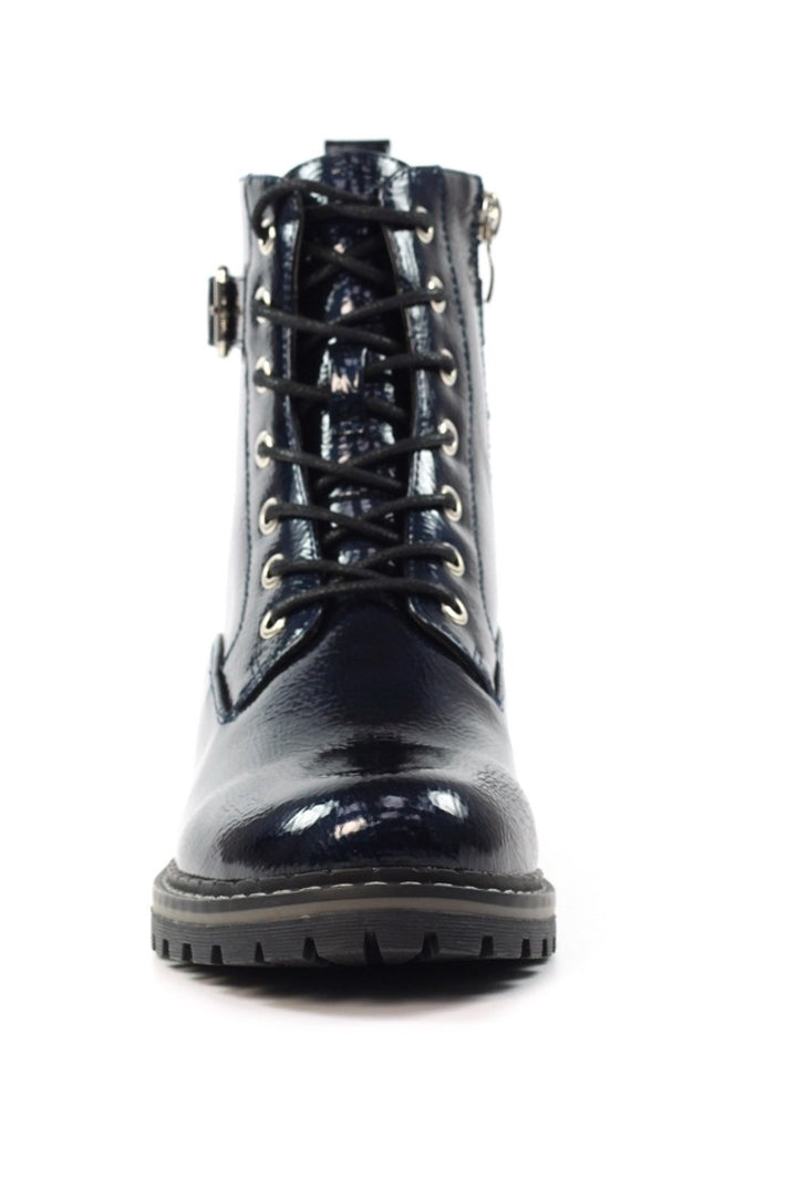 Navy patent leather boot on a white background