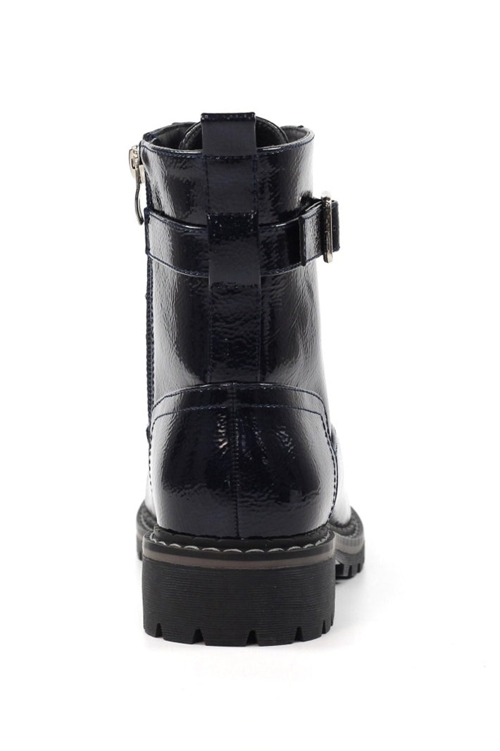 Navy patent leather boot with buckle on a white background