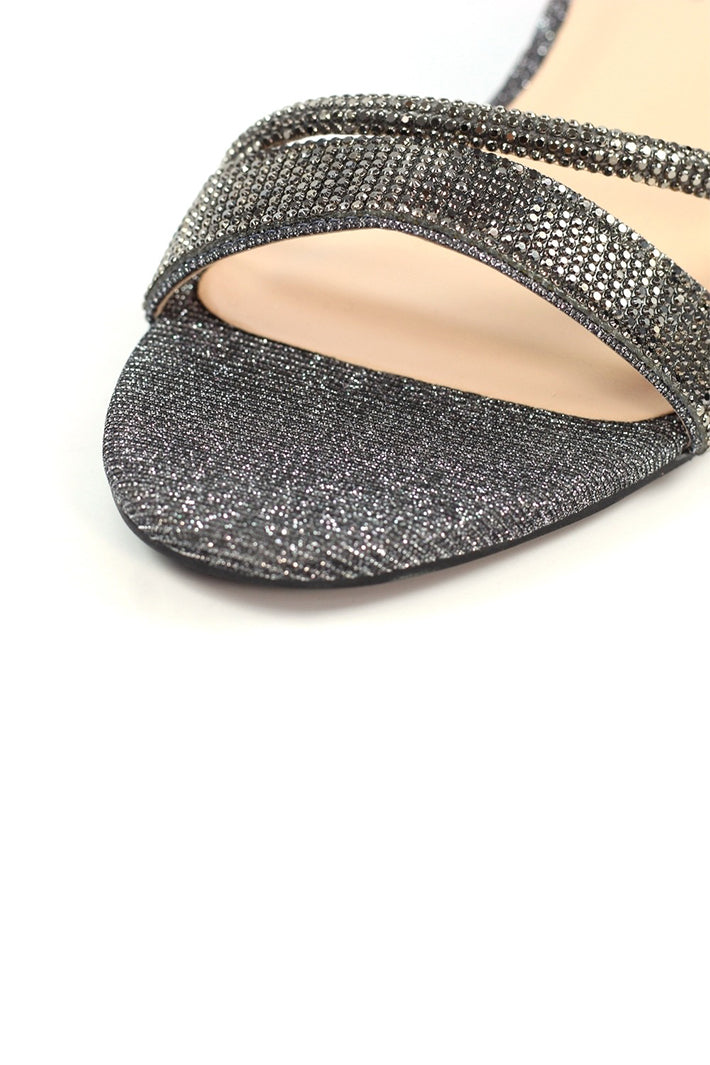Silver glittery sandal on a white background