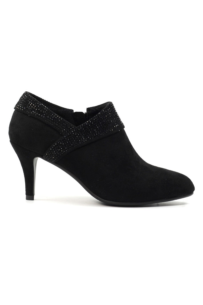 Black high-heeled shoe with a studded detail on a white background