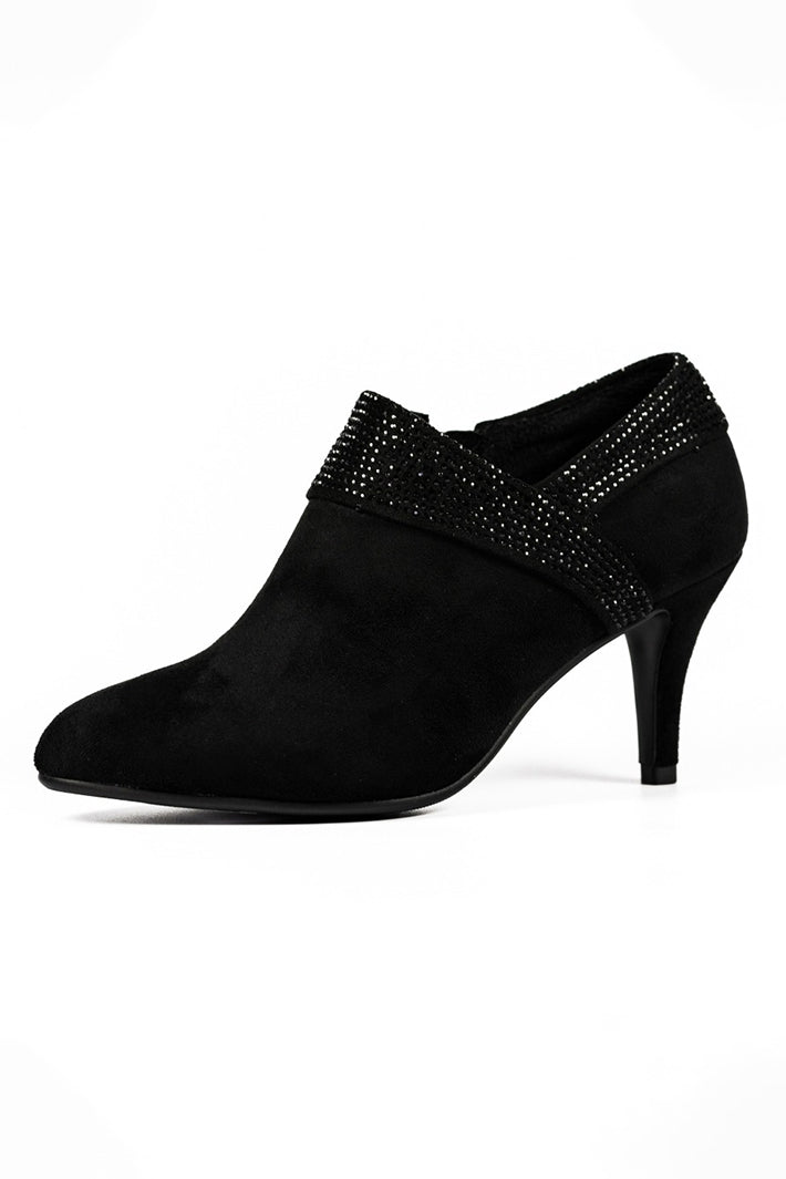 Black high-heeled shoe with embellishments on a white background