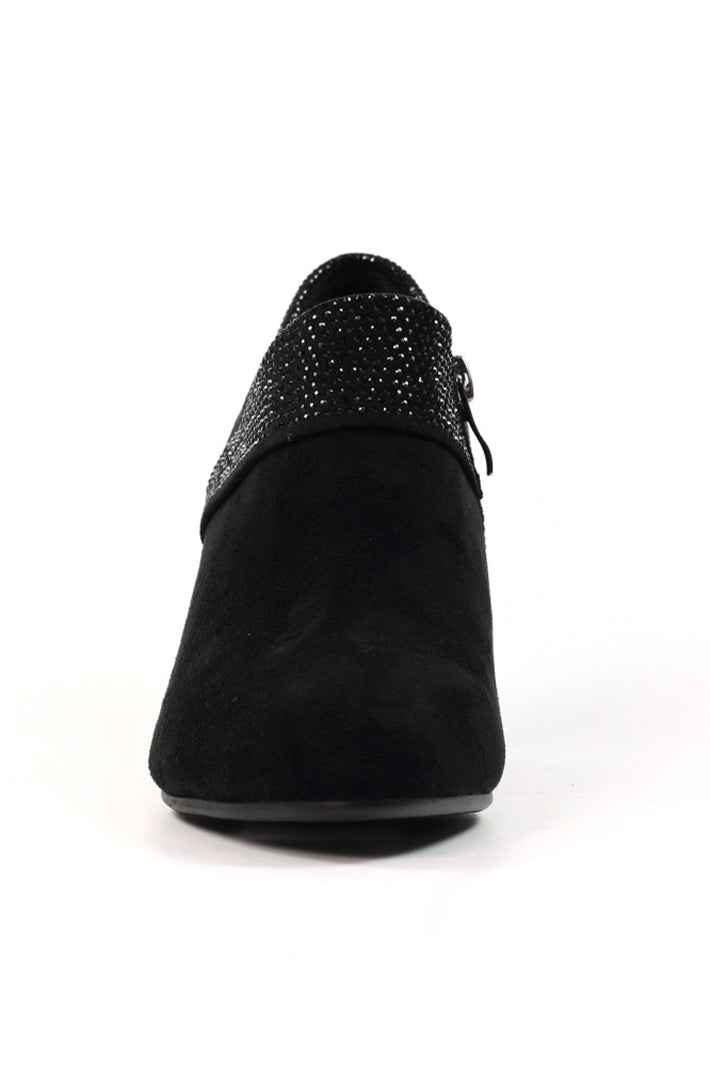 Black shoe with studded detail on a white background