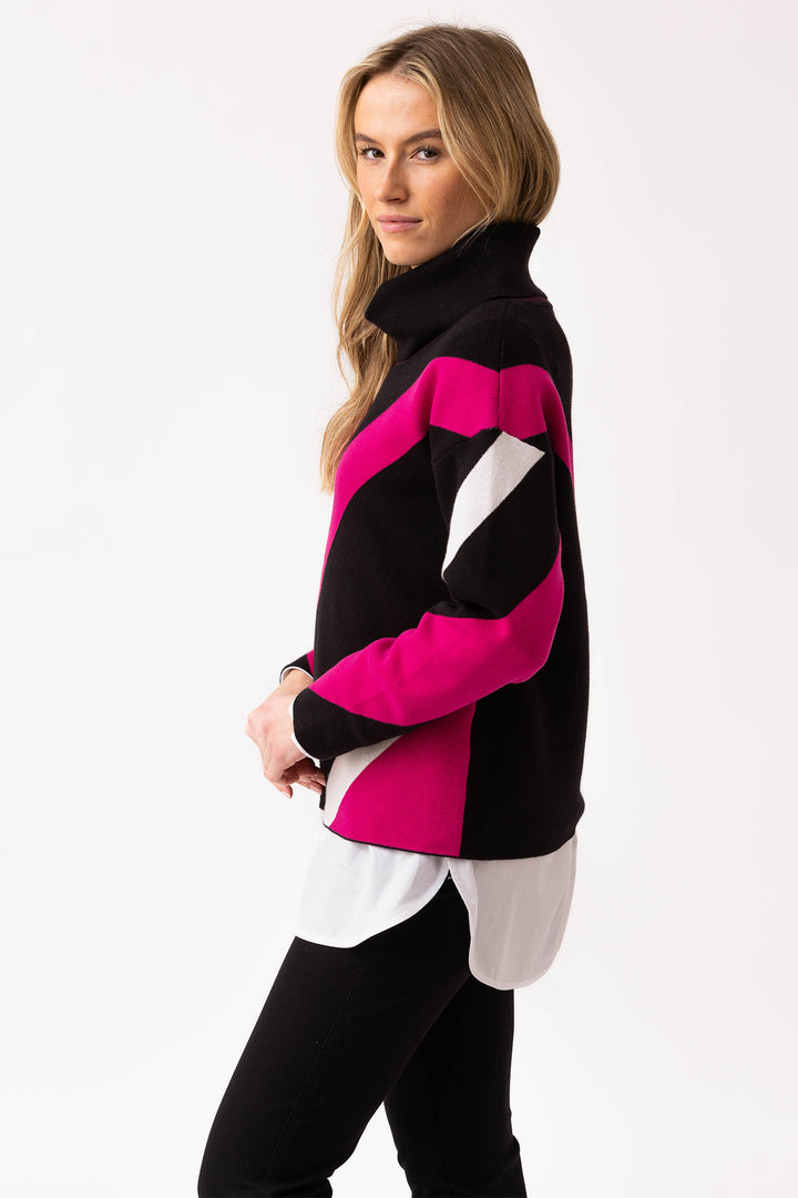 Woman wearing a black, pink, and white patterned jacket on a white background