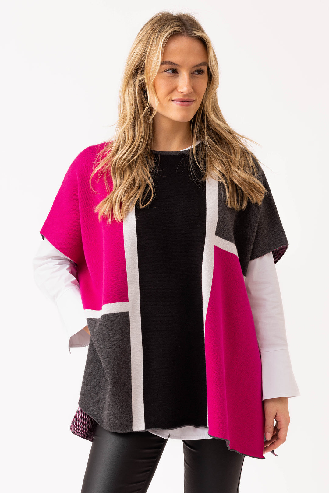 Woman wearing a colorful cardigan with a white background