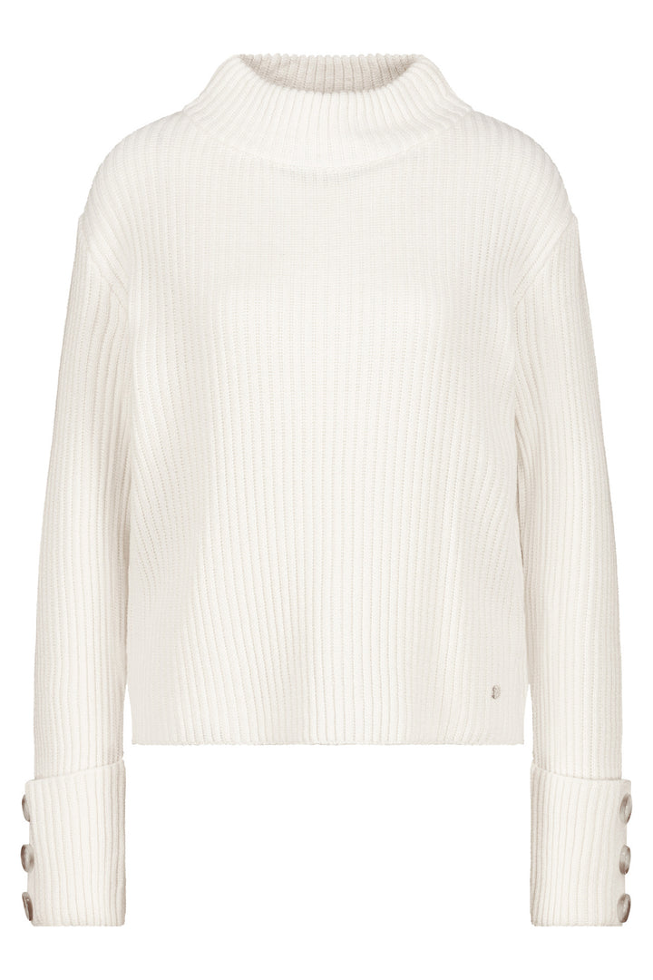 White ribbed sweater with button details on a white background