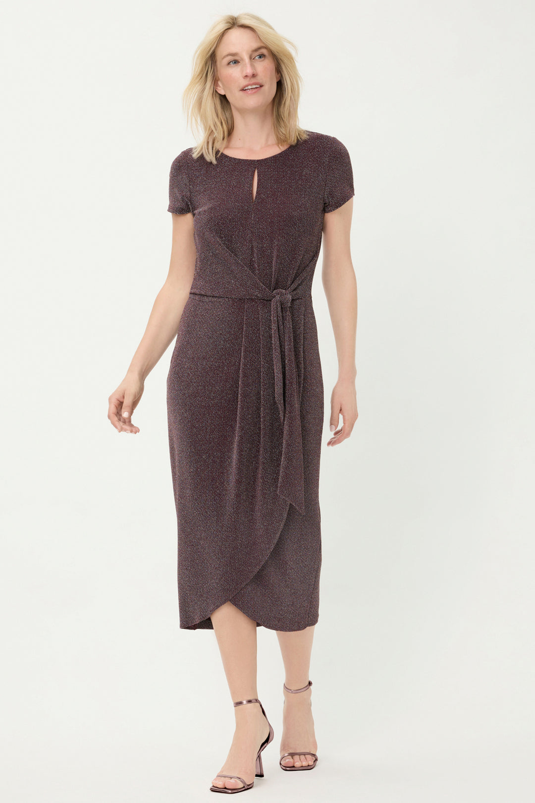 Woman wearing a dark wine dress on a white background