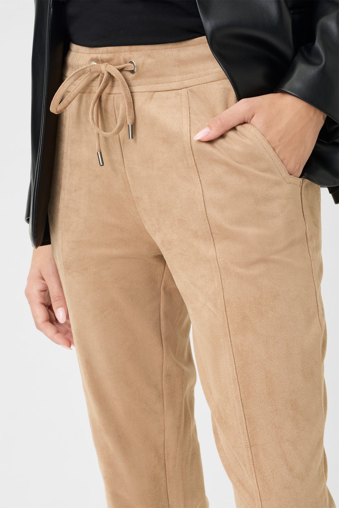 Tan jogger pants with drawstring waist on a white background