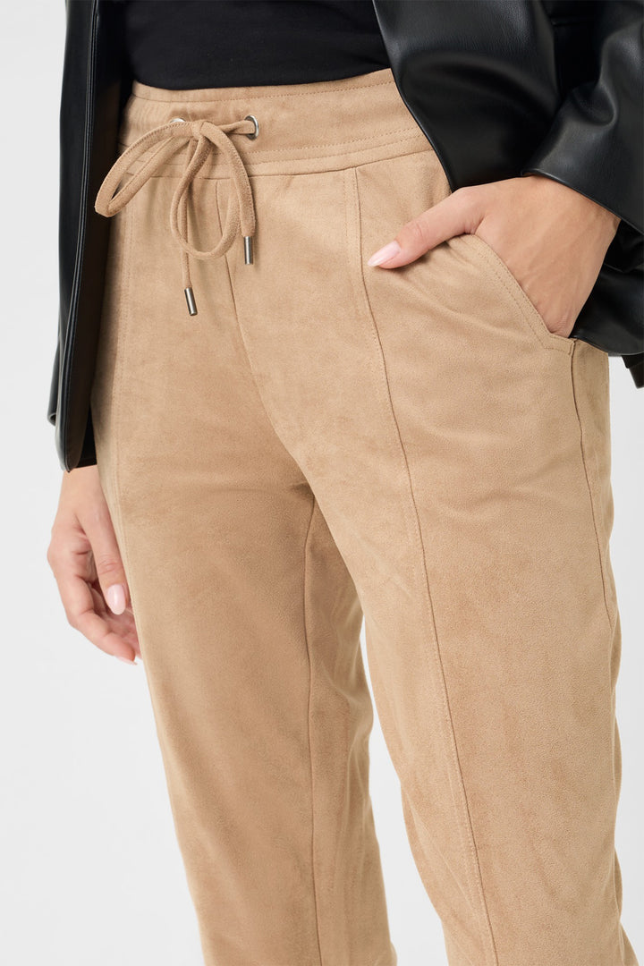 Tan jogger pants with drawstring waist on a white background