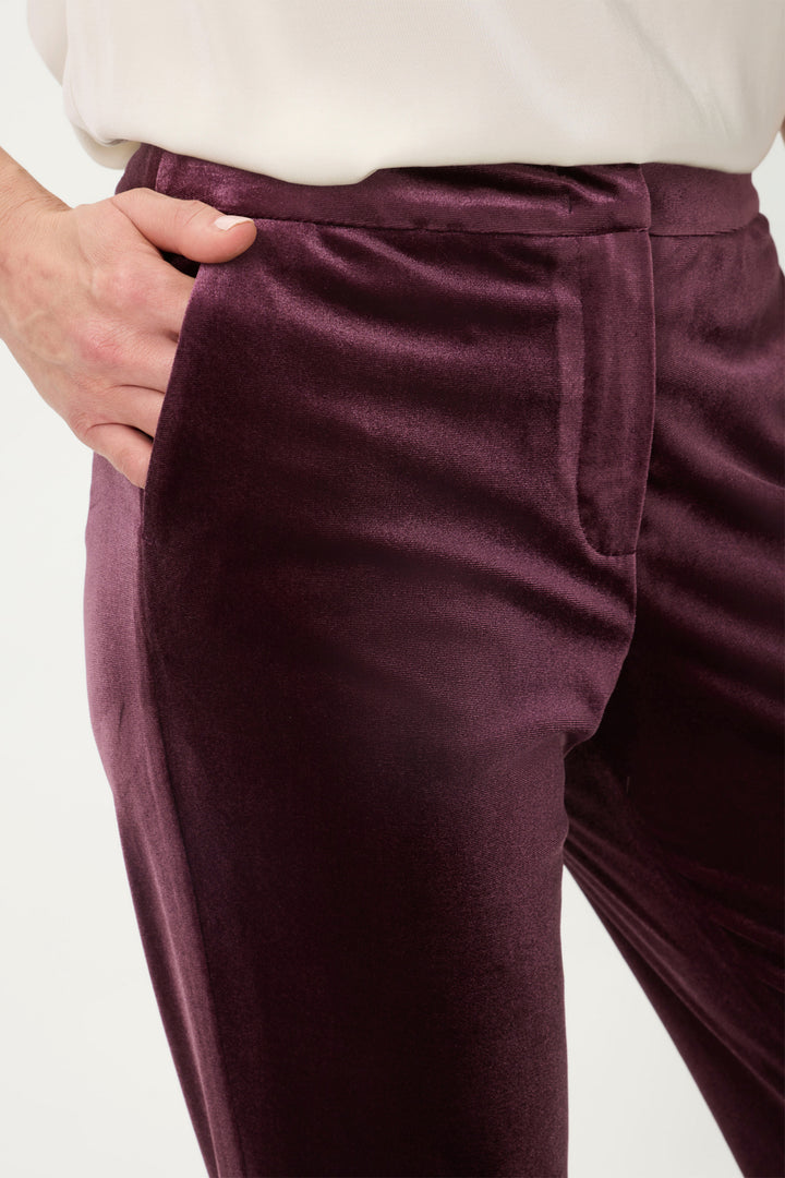 Close-up of Dark wine pants with a white background