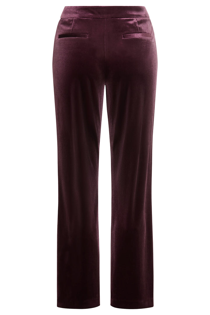Dark wine velvet pants on a white background