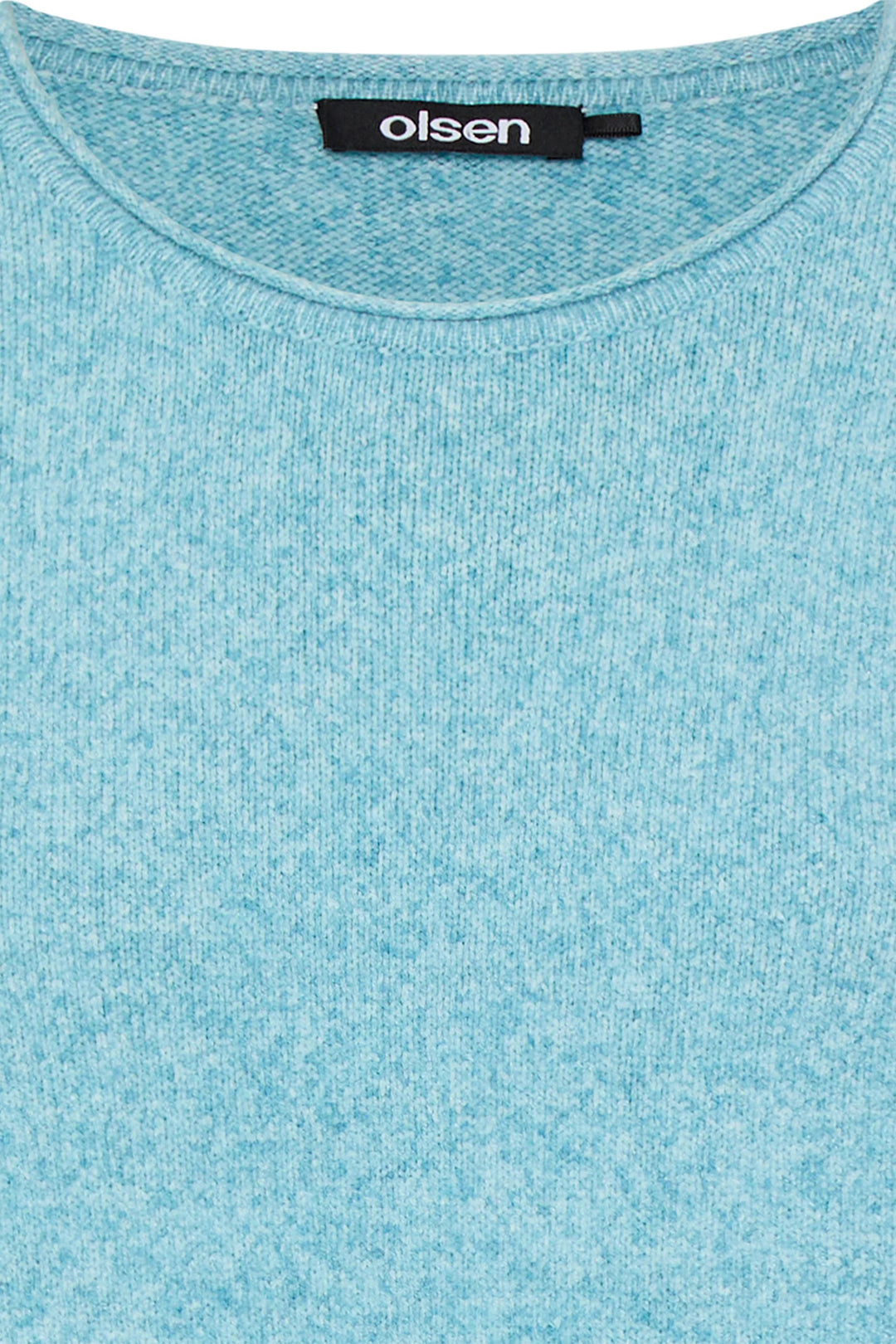 Close-up of a light blue shirt with 'olsen' label on collar