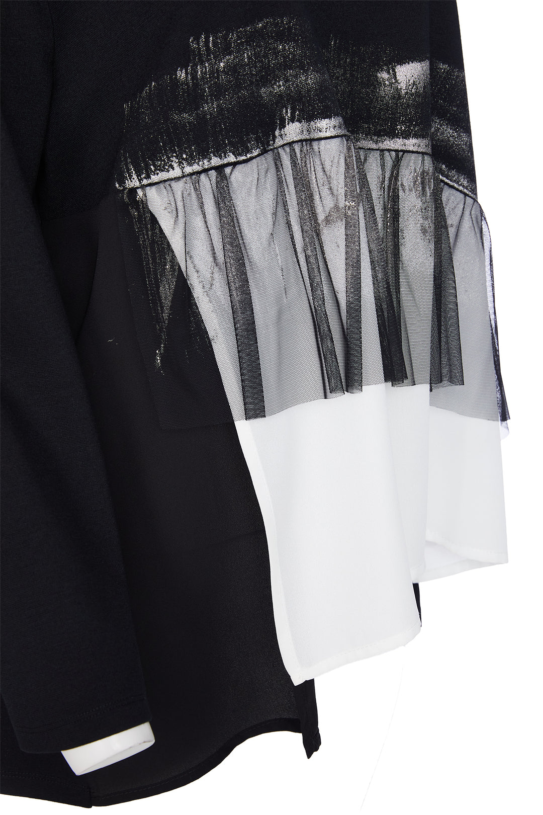 Black and white layered garment with sheer overlay