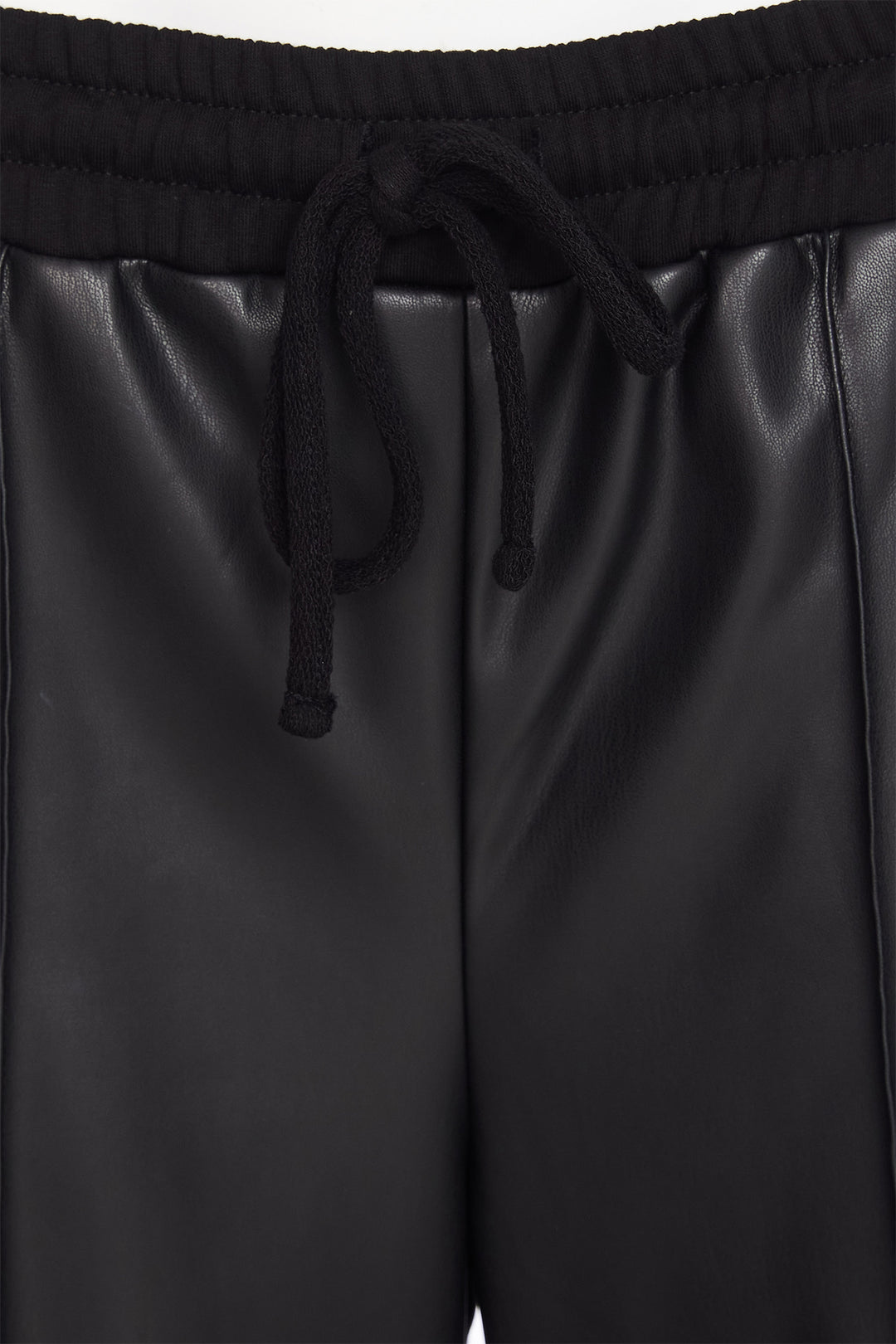 Black leather shorts with drawstring waistband on a plain background