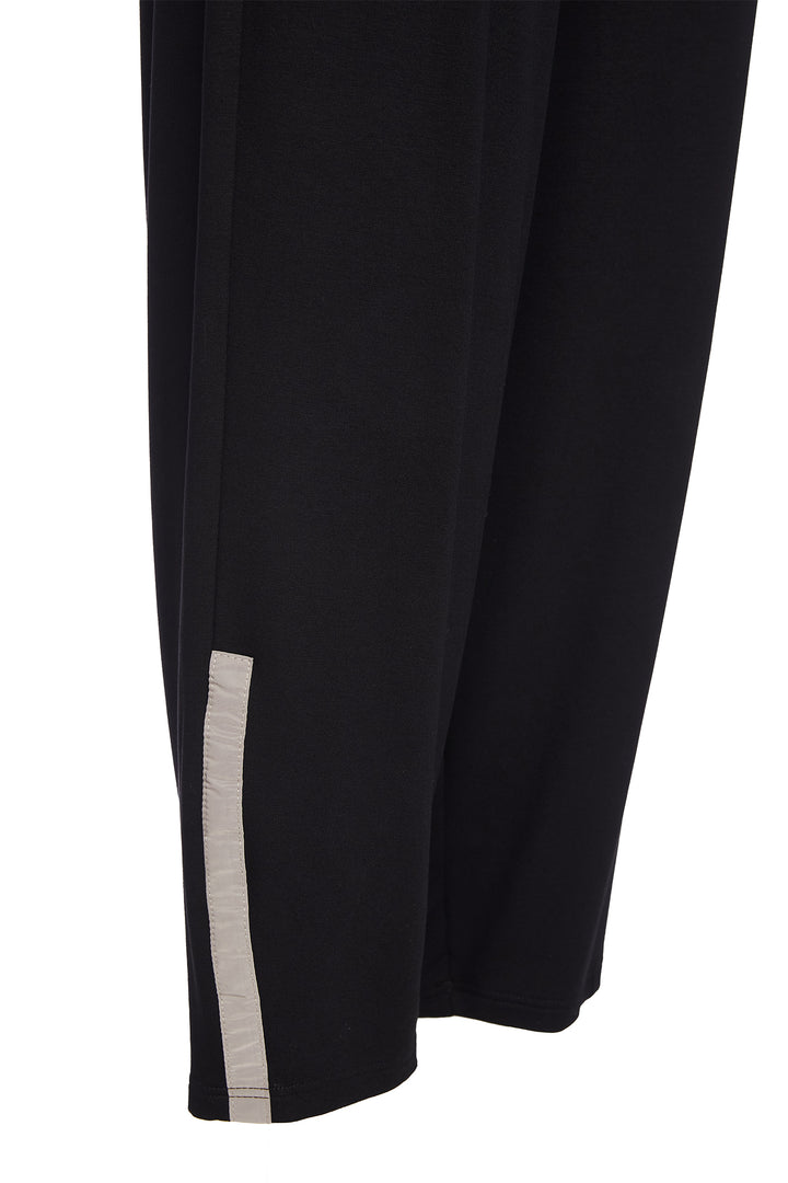 Black pants with a white stripe on a white background