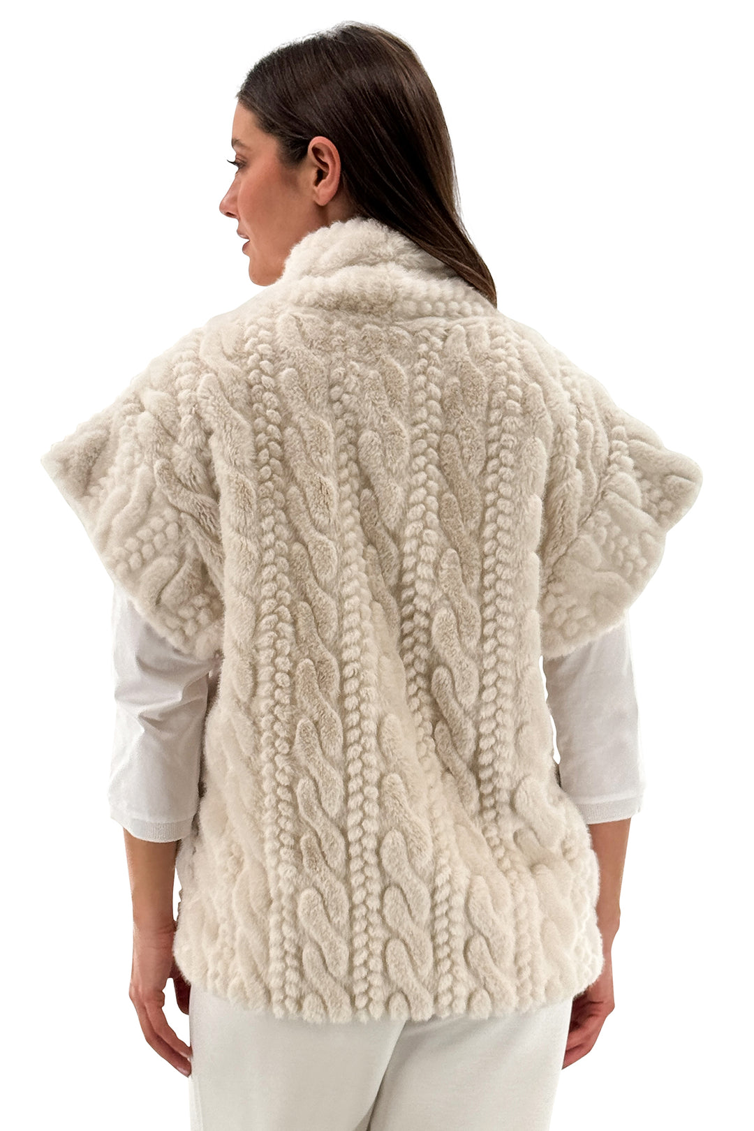 Woman wearing a cream-colored knitted vest on a white background