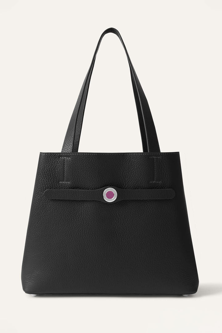 Black textured tote bag with a pink button on a white background