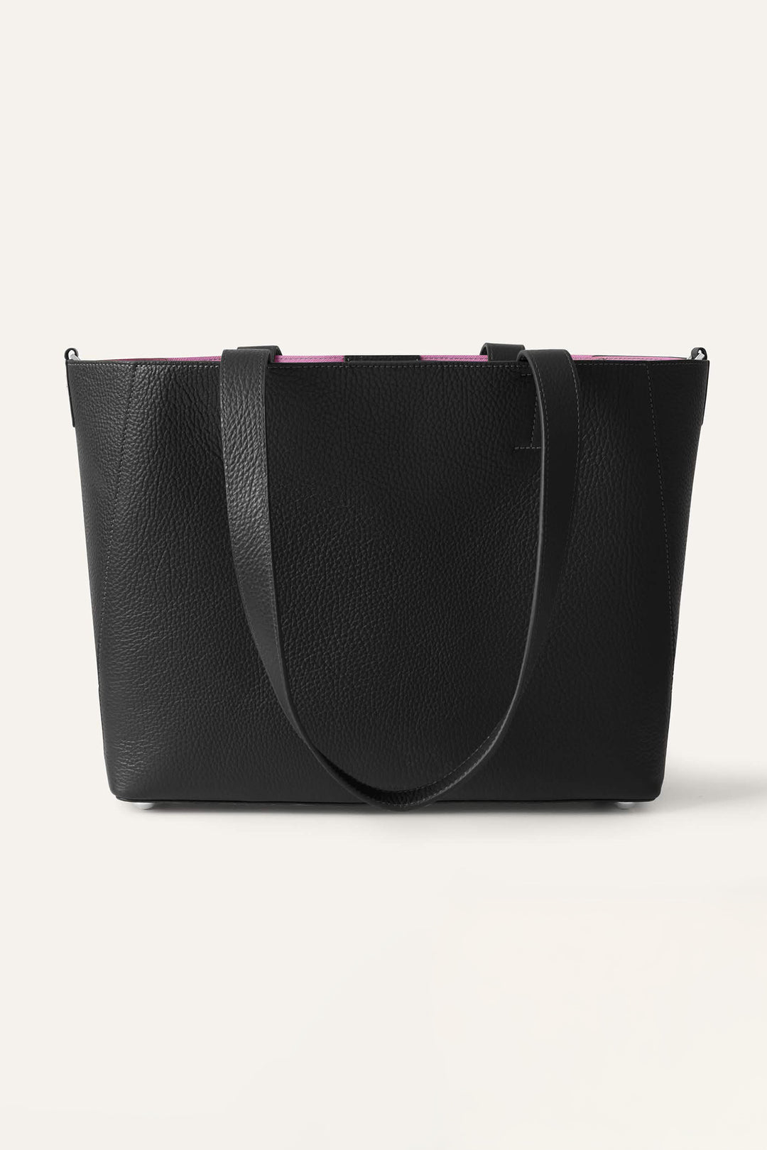 Black handbag with pink interior lining on a light gray background