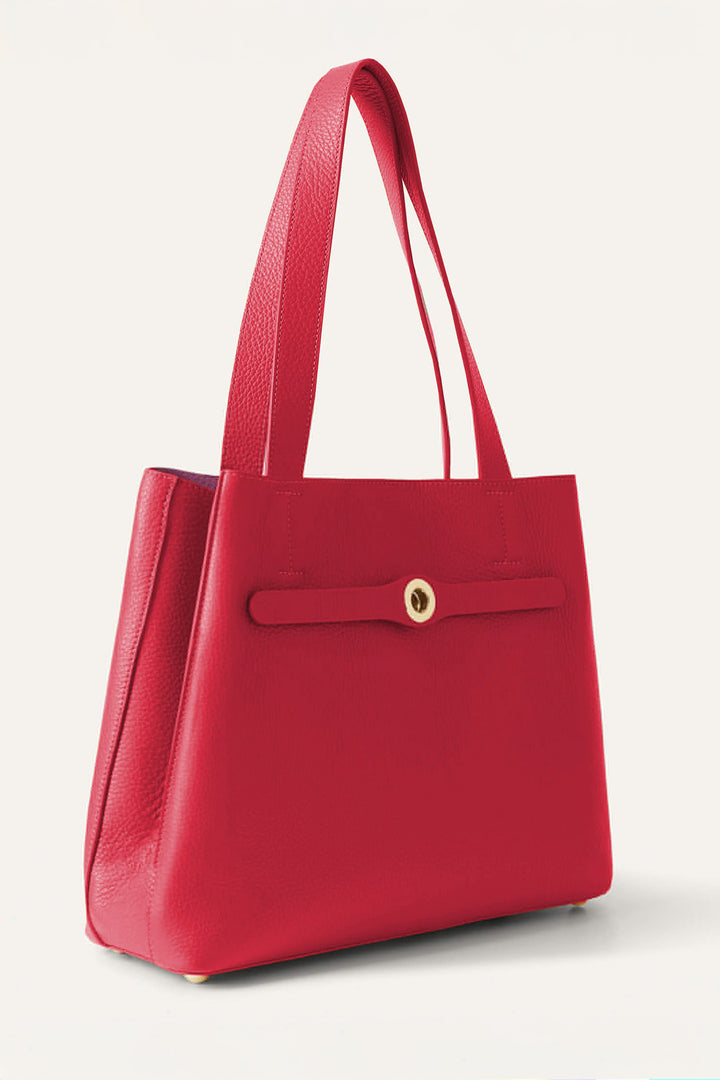 Red handbag with a gold clasp on a light gray background