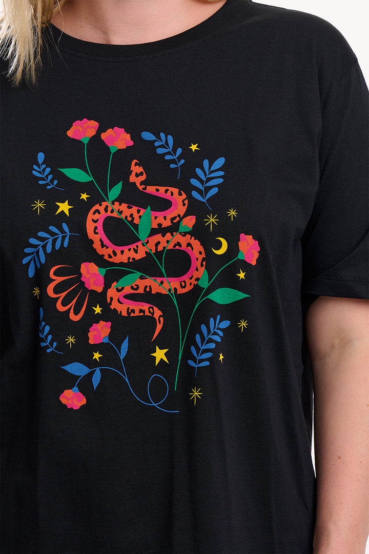 Black t-shirt with a colorful snake and floral design on a person wearing it.
