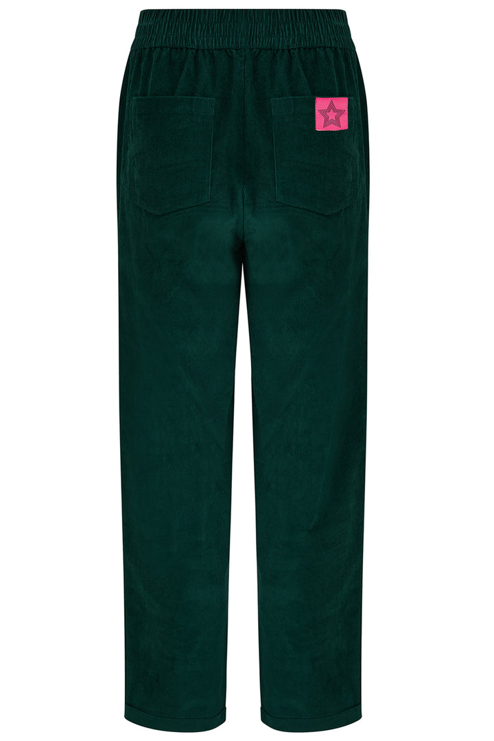 Dark green pants with a pink patch on a white background